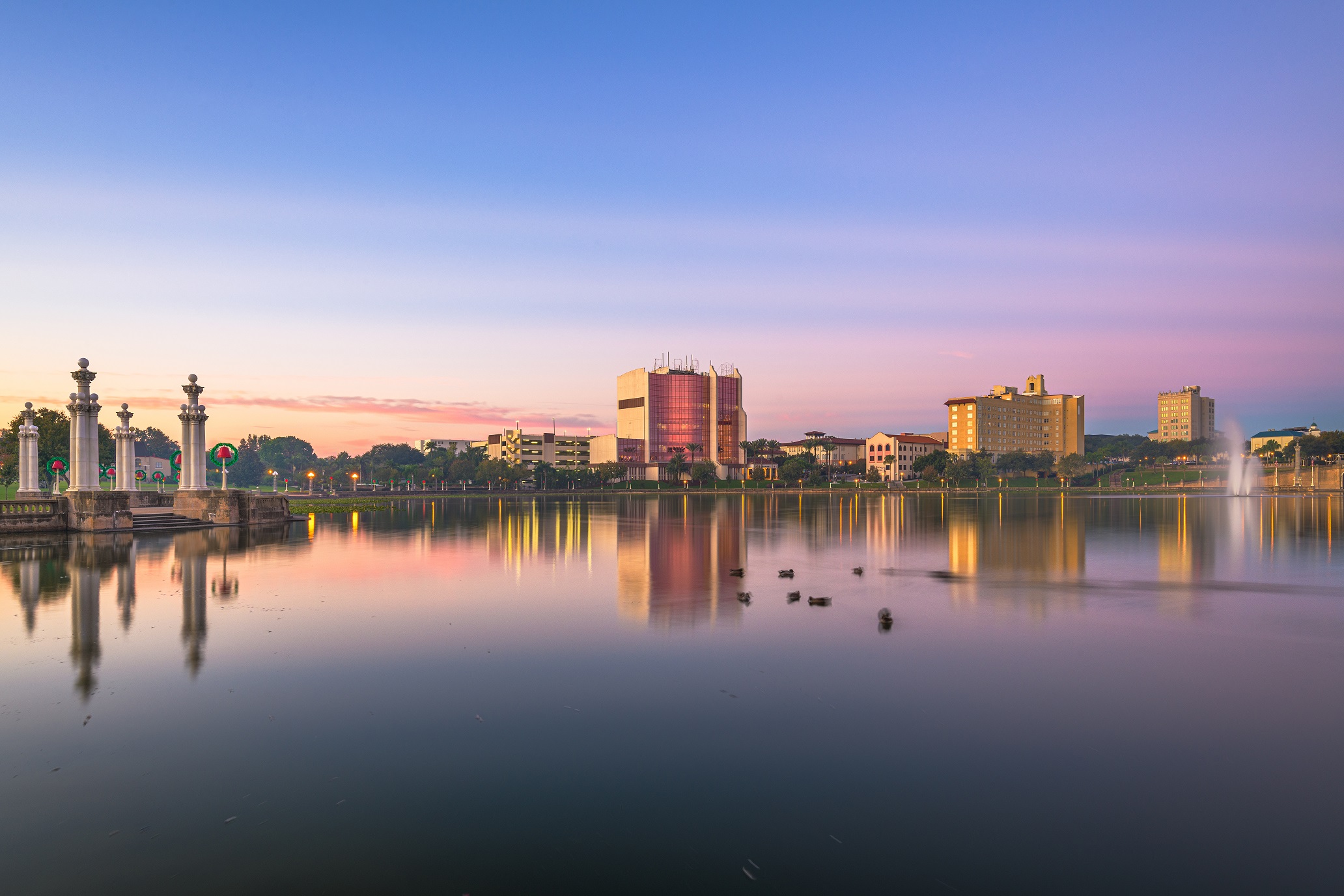 Lakeland, Florida, USA downtown cityscape on the lake at twilight.